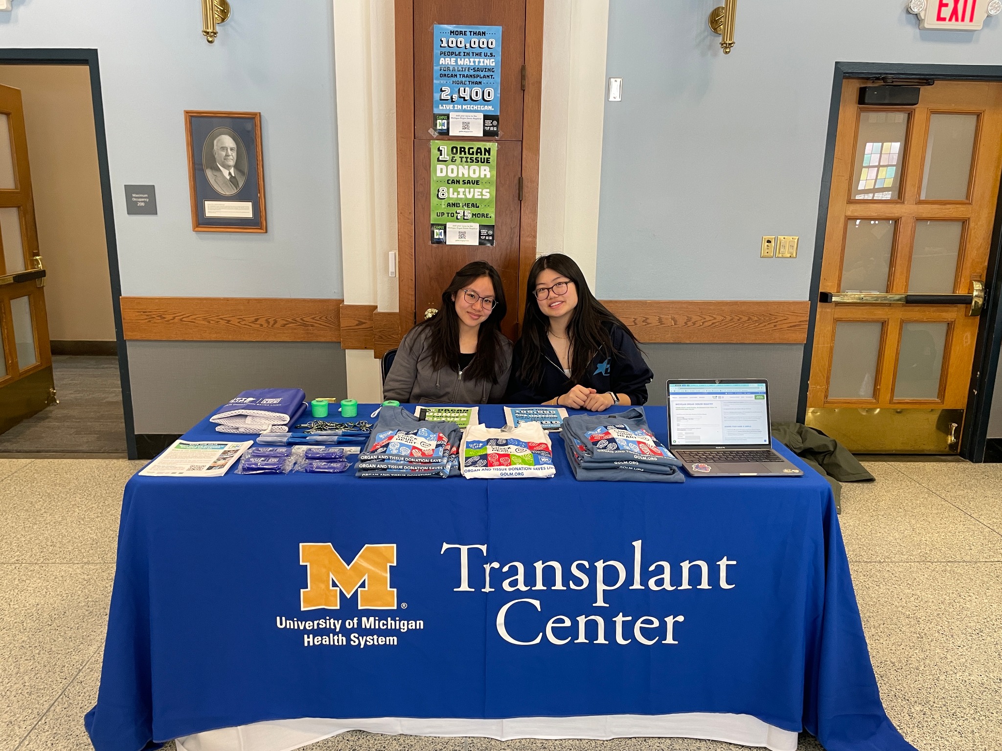 OTHA members welcoming students at a University of Michigan Transplant Center outreach table