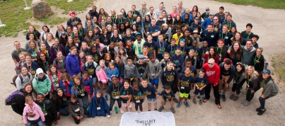 Camp Michitanki campers, volunteers, and staff gathered for a group photo