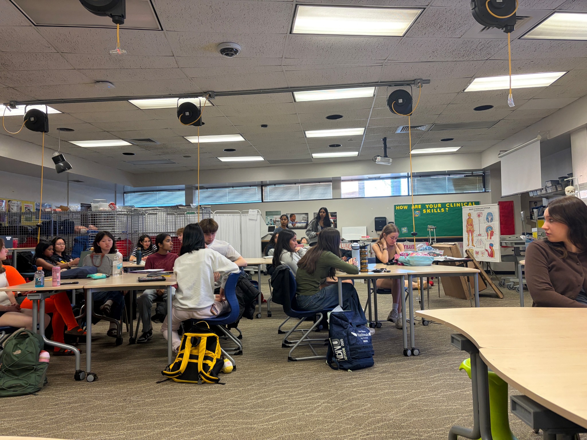 OTHA members speaking with students during high-school outreach