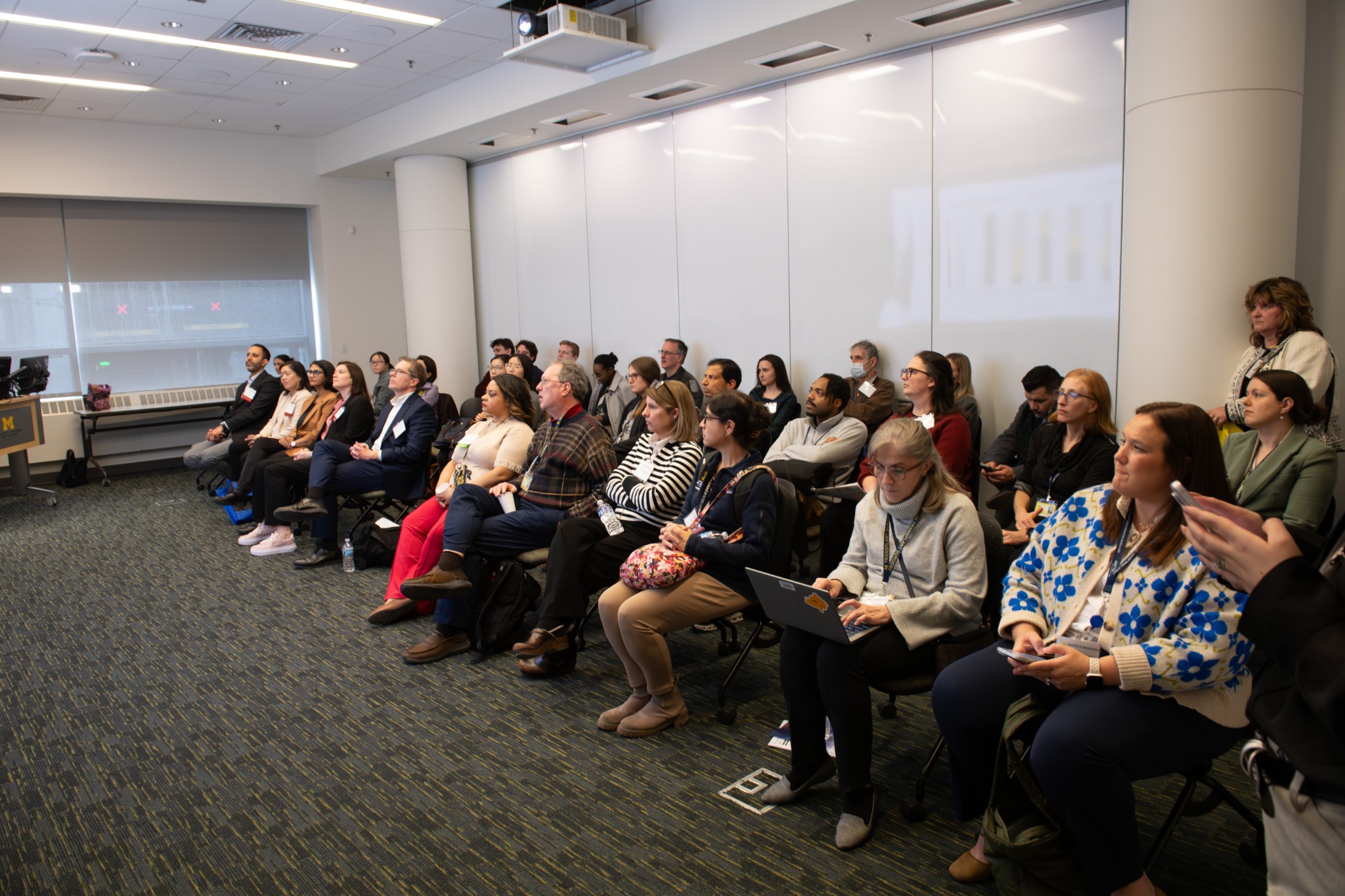 Audience listening to a presentation at the second research symposium